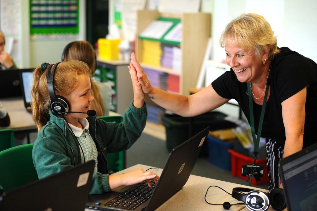 live intervention with pupil high fiving her teacher