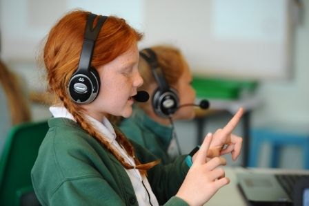 Girl with red hair engaging with one-to-one intervention